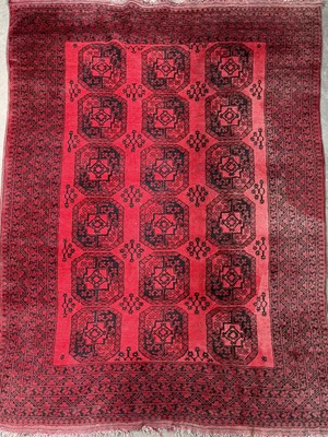 Lot 422 - A hand knotted Afghan rug c.1920's, with red...