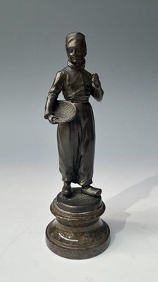 Lot 127 - A cast metal Orientalist bronzed sculpture of...