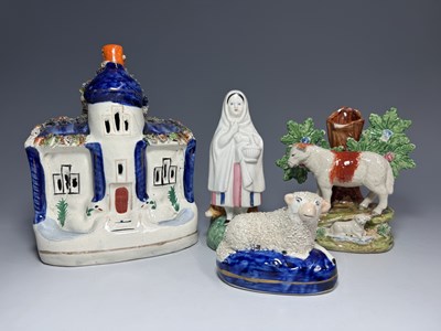 Lot 70 - A group of polychrome Staffordshire models, a...