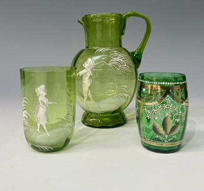 Lot 93 - A Mary Gregory-type cameo green glass jug with...