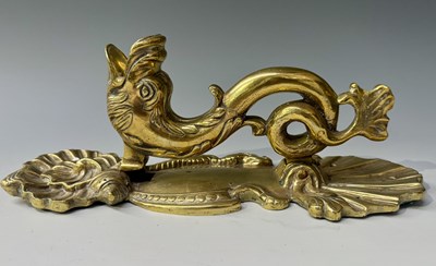 Lot 129 - A Rococo style brass door knocker in the form...