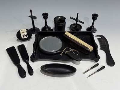 Lot 29 - A group of carved and turned ebony items, late...