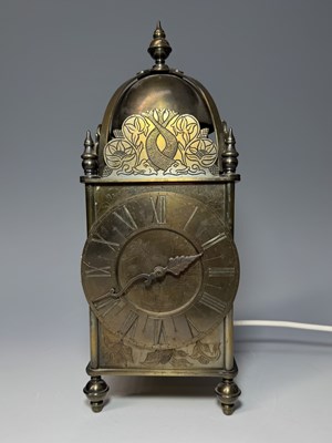 Lot 130 - A brass lantern clock, c.1920, etched foliate...