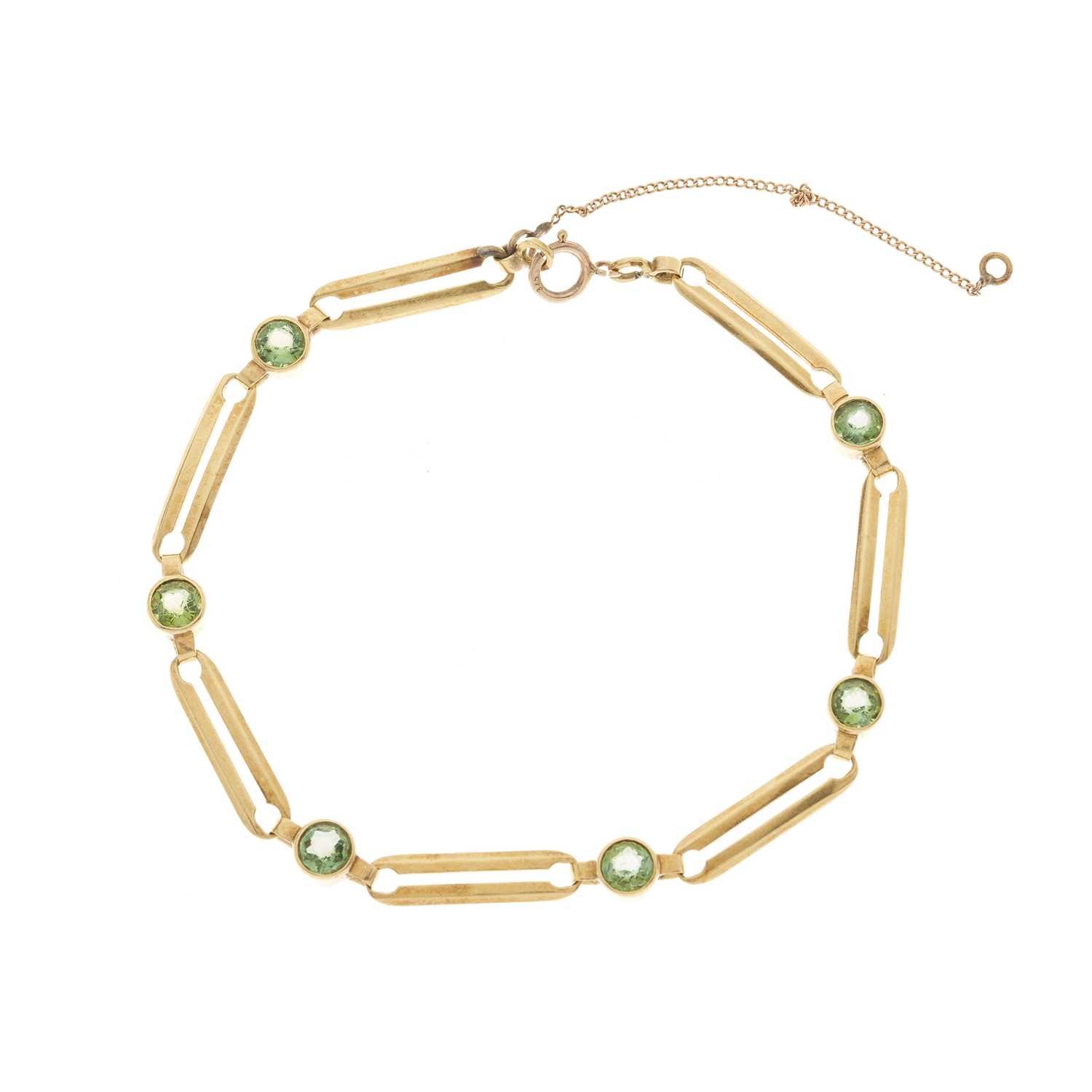 Lot 94 - A gold peridot line bracelet