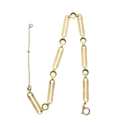 Lot 94 - A gold peridot line bracelet