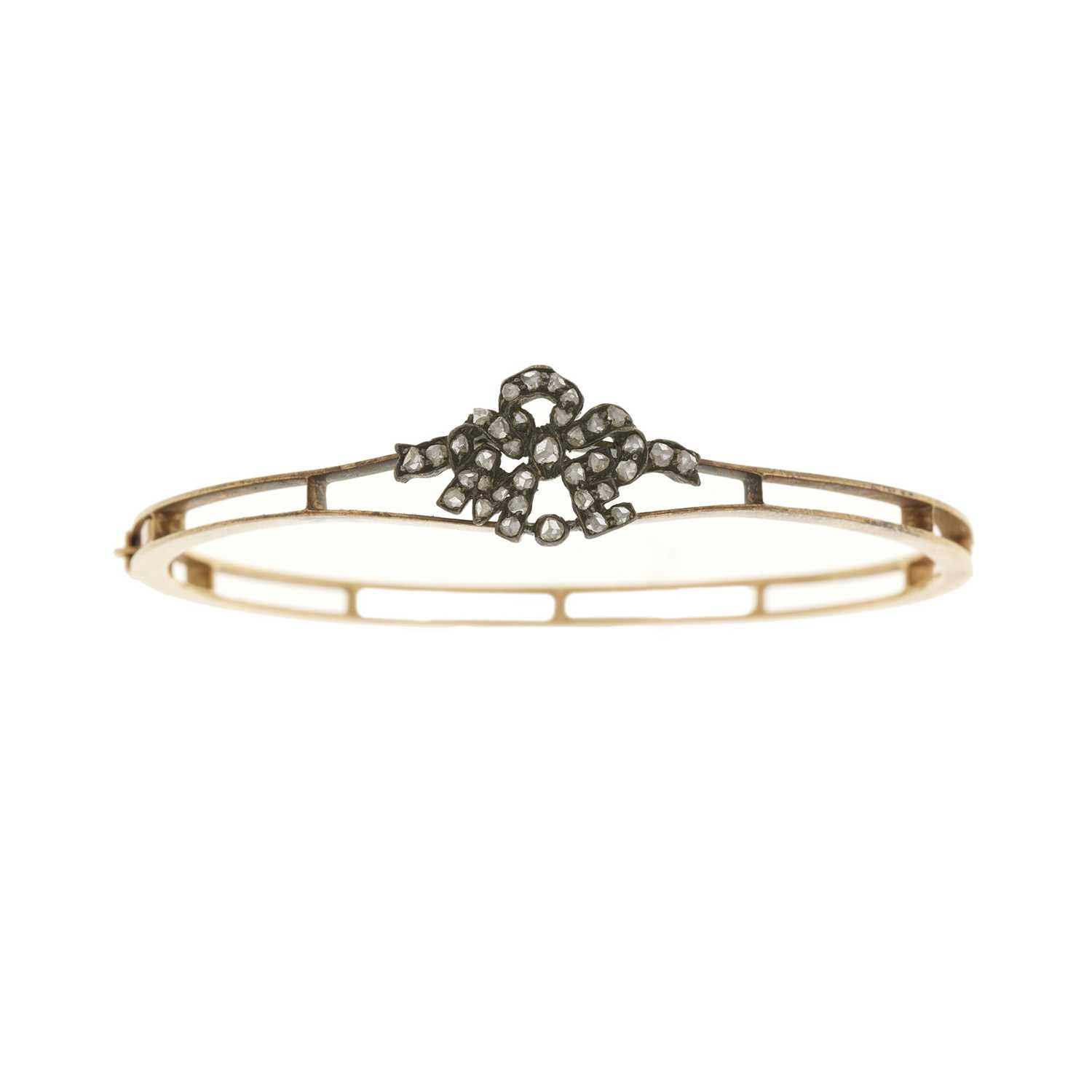 Lot 9 - An early 20th century gold diamond bangle bracelet