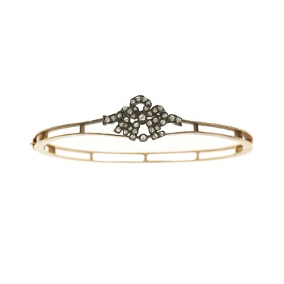Lot 9 - An early 20th century gold diamond bangle bracelet