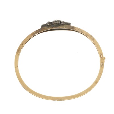 Lot 9 - An early 20th century gold diamond bangle bracelet
