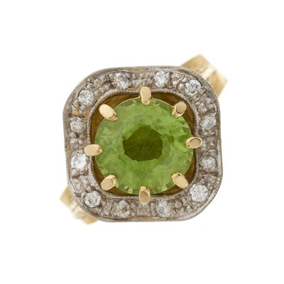 Lot 137 - A 1970s 18ct gold peridot and diamond dress ring