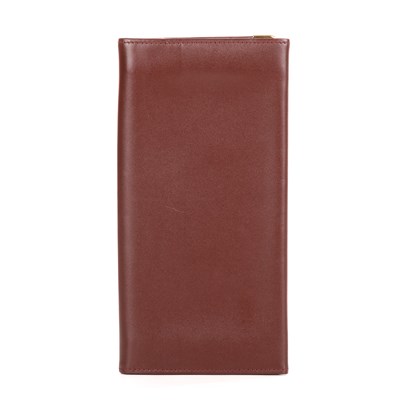 Lot 290 - Cartier, a long Bordeaux Bifold wallet,...