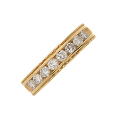 Lot 153 - An 18ct gold diamond half eternity band ring