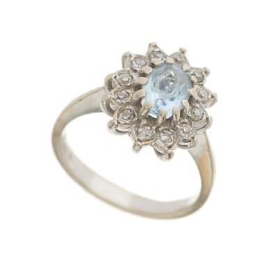 Lot 173 - An 18ct gold aquamarine and diamond cluster ring