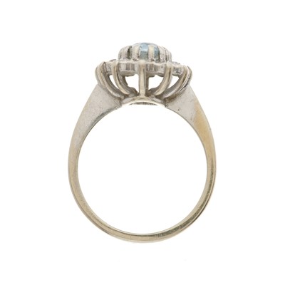 Lot 173 - An 18ct gold aquamarine and diamond cluster ring