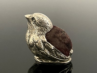 Lot 57 - An Edwardian novelty silver pin cushion,...