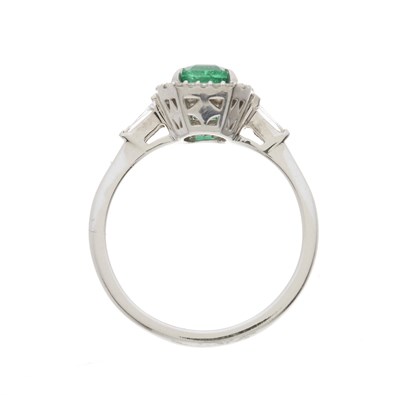 Lot 189 - An 18ct gold emerald and diamond cluster dress ring