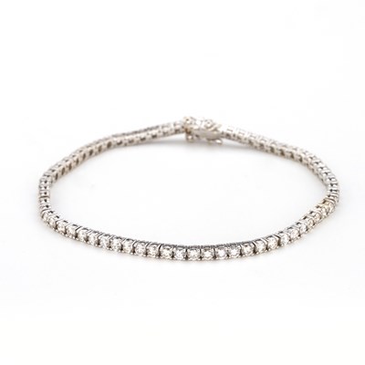 Lot 22 - An 18ct gold diamond line bracelet