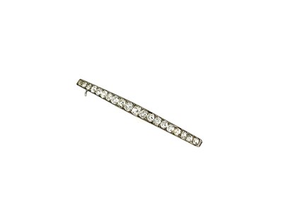 Lot 7 - An 18ct gold and diamond bar brooch, twenty...