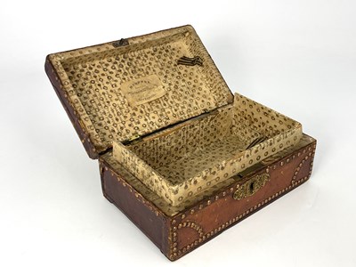 Lot 209 - A George III tan leather bound and metal...