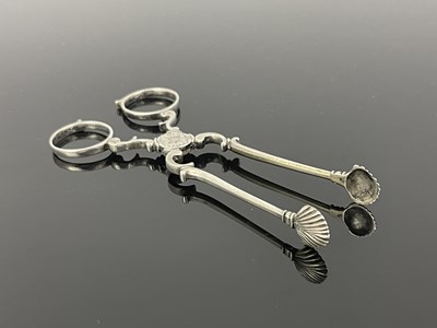 Lot 92 - A pair of Eighteenth-century silver tea tongs,...