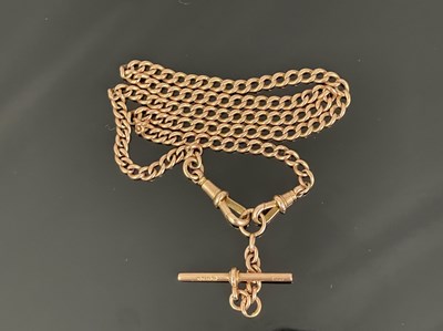 Lot 10 - A 9 carat gold watch chain, fob links and T...