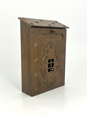Lot 127 - An Arts and Crafts copper letter box, repousse...