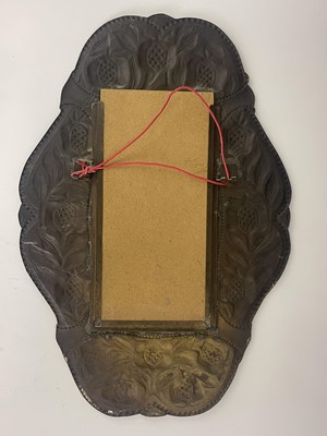 Lot 148 - An Arts and Crafts brass mirror, in the...