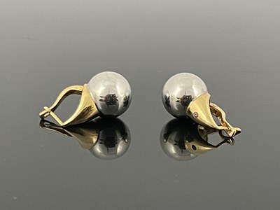 Lot 13 - A matched pair of 14 carat gold bi colour...