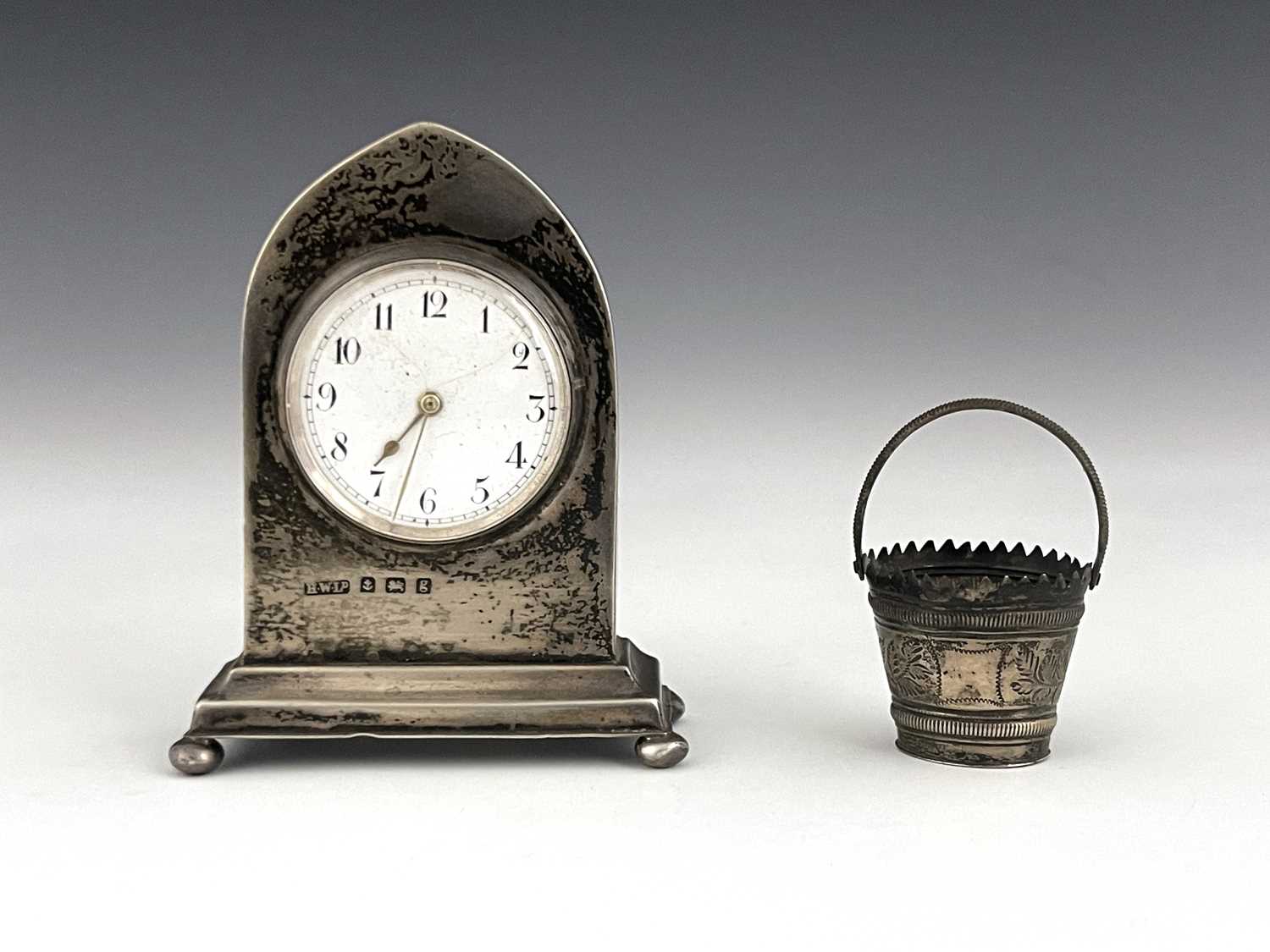 Lot 59 - An Edwardian silver desk clock and a novelty...