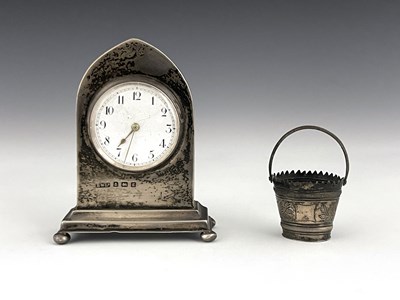 Lot 59 - An Edwardian silver desk clock and a novelty...