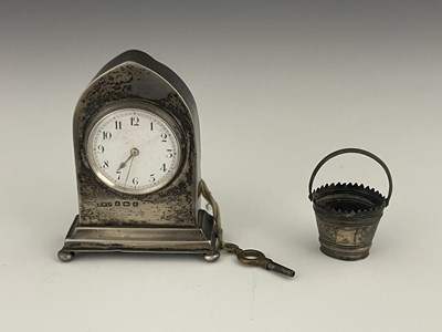 Lot 59 - An Edwardian silver desk clock and a novelty...