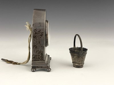 Lot 59 - An Edwardian silver desk clock and a novelty...