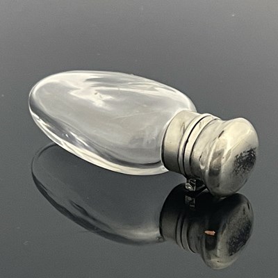Lot 23 - A Victorian silver-mounted rock crystal scent...