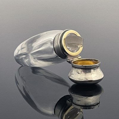 Lot 23 - A Victorian silver-mounted rock crystal scent...