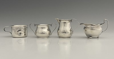Lot 458 - An Edwardian silver cream jug, of squat...