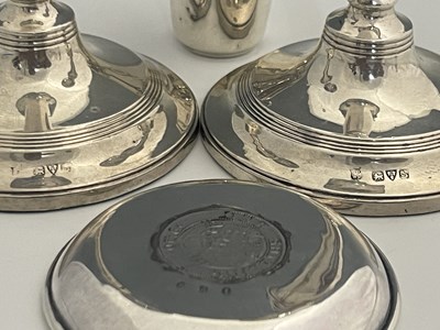 Lot 13 - A pair of George V silver candlesticks, each...