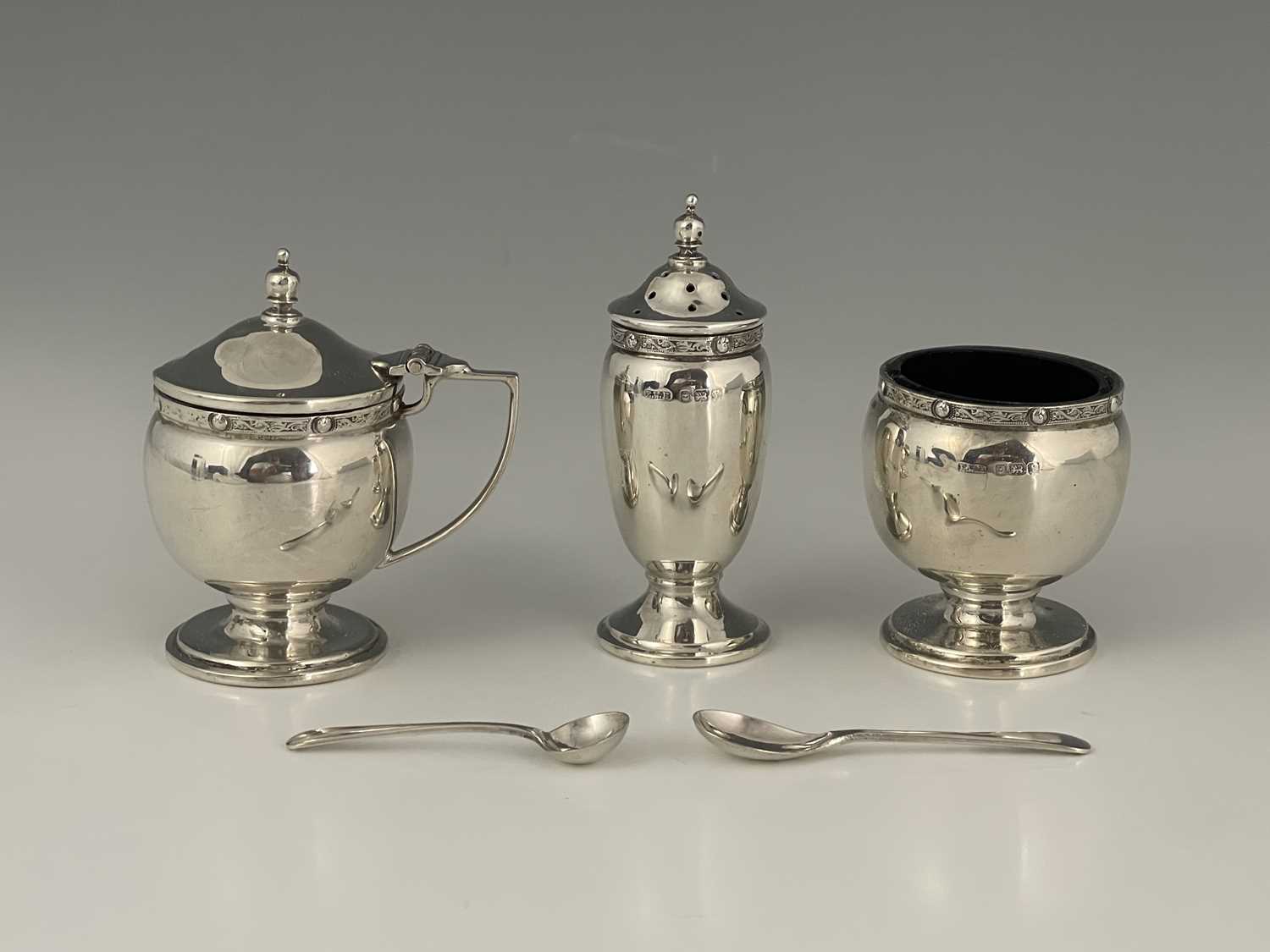 Lot 14 - A George VI silver condiment set, in the...